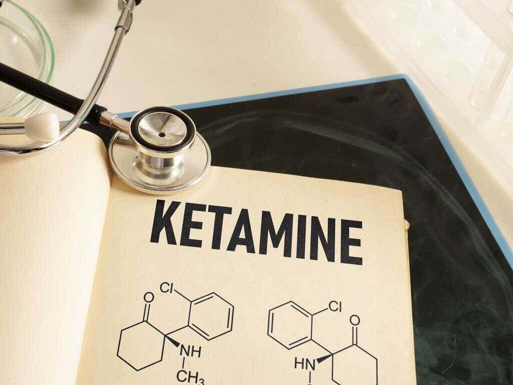 Ketamine is shown using the text chemical model of formula of medical drug ketamine therapy